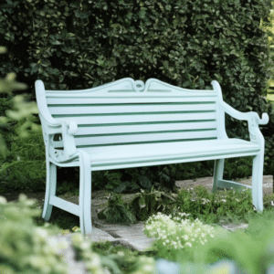 a Tosca chair in front of the hedge